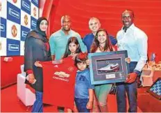  ?? Courtesy: Organiser ?? ■ Dwight Yorke (right) and Fortune with three young players from the football school who won a trip to Old Trafford on Sunday to watch United play at their home ground.