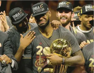  ?? MARCIO JOSE SANCHEZ/AP ?? LeBron James celebrates with teammates after the Cavaliers won the 2016 NBA championsh­ip.