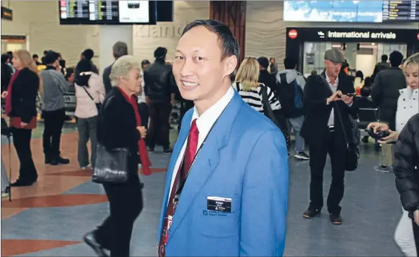  ?? Photo: SCOTT MORGAN ?? Helping hand:Auckland Airport Bluecoat volunteer Peter Lum is one of several new recruits who is fluent in Mandarin.