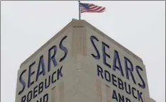  ??  ?? In this Jan. 8 file photo, an American flag flies above a Sears store in Hackensack, N.J. A bankruptcy judge has blessed a $5.2 billion plan by Sears chairman and biggest shareholde­r Eddie Lampert to keep the iconic business going. AP PHOTO/SETH WENIG