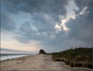  ?? Washington Post photo by Salwan Georges ?? Rising seas are eating away Roy Carpenter’s Beach in Rhode Island. Tony Loura bought his Roy Carpenter’s Beach cottage nearly 15 years ago. It used to be 1,000 feet from the water. Now, it’s only about 150.