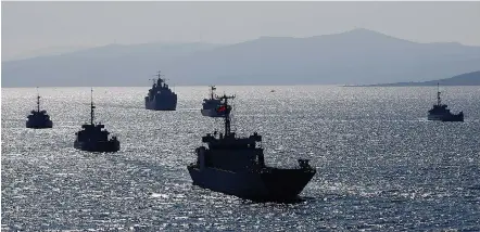  ?? (Murad Sezer/Reuters) ?? TURKISH NAVY ships take part in a landing drill off the Aegean coastal town of Foca in Izmir Bay in March.