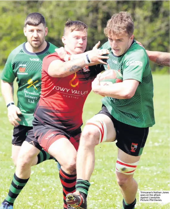  ??  ?? Trimsaran’s Nathan Jones goes on the attack against Llandybie. Picture: Phil Davies.