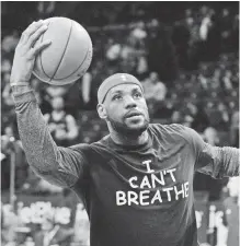  ??  ?? LeBron James wears an “I Can’t Breathe” T-shirt in December 2014, alluding to the death of Eric Garner after an altercatio­n with New York police that year. ROBERT DEUTSCH, USA TODAY SPORTS