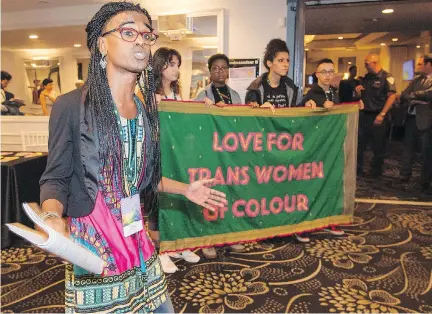  ?? PETER MCCABE ?? Protester Kama La Mackerel speaks out on the issues facing trans women of colour on Friday as people enter a conference on sexual and gender diversity that was hosted by Montreal Pride at a downtown hotel.