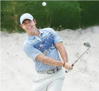  ?? AFP ?? Rory McIlroy of the American Nurses Foundation team plays a shot from a bunker on the second hole on Sunday.