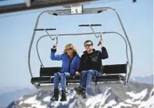  ??  ?? 2017 Emmanuel Macron and his wife Brigitte Trogneux sit on a chairlift on their way to the mountain top for a lunch break during a campaign visit in Bagneres de Bigorre, in the Pyrenees mountain, France, on April 12, 2017.