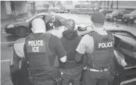  ??  ?? Photo fournie le 11 février par les services américains de l’immigratio­n et des douanes (ICE) de l’arrestatio­n d’un homme lors d’une opération le 7 février à Los Angeles
