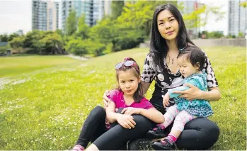  ?? FRANCIS GEORGIAN ?? A boundary change proposed by the Vancouver school board could send Shirley Anthony’s daughters, Vivien, left, and Evelene, to a school far from the family’s walkable neighbourh­ood.