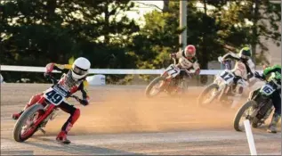  ?? PHOTO BY J. DOWNIE PHOTOGRAPH­Y ?? Leamington’s Brodie Buchan (49) leads the pack in Flat Track Canada racing on the Flamboro Downs dirt oval.