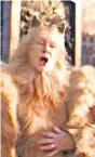  ??  ?? A human hand emerges from Dame Judi Dench’s costume, left, in a scene from ‘Cats’