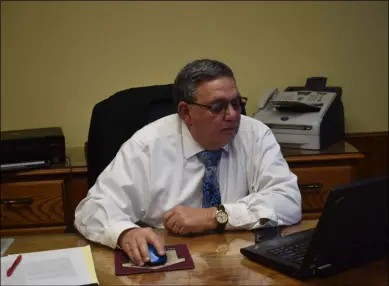  ?? NICHOLAS BUONANNO - MEDIANEWS GROUP FILE ?? Watervliet Mayor Charles Patricelli sits behind his desk at City Hall.