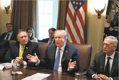  ?? Oliver Contreras / TNS ?? President Trump is flanked by Secretary of State Mike Pompeo (left) and Defense Secretary James Mattis during a Cabinet meeting June 21. Pompeo and Mattis are coming to the Bay Area next week to meet with Australian officials at Stanford University.