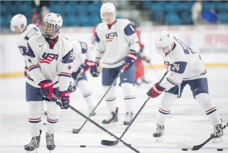  ?? — CP ?? Jack Hughes, left, and brother Quinn, right, combined their considerab­le talents to help Team USA down a Canadian squad 7-5 on Tuesday at the world junior showcase.