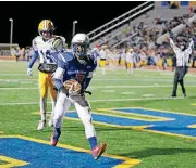  ?? [PHOTO BY SARAH PHIPPS, THE OKLAHOMAN] ?? Millwood’s De’Mariyon Houston scores a touchdown during last season’s state title game. Houston is one of many returning stars for the Falcons.