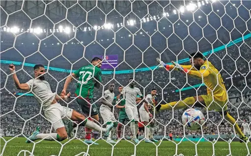  ?? MOISES CASTILLO/AP ?? Henry Martin (20) scored in the 48th minute Wednesday against Saudi Arabia to end Mexico’s 431-minute goal drought. Luis Chavez also scored.