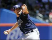  ?? FRANK FRANKLIN II — THE ASSOCIATED PRESS ?? Tampa Bay Rays’ Nathan Eovaldi delivers a pitch during the first inning of a baseball game against the New York Mets, Sunday in New York.