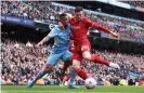  ?? Photograph: Carl Recine/Action Images/Reuters ?? Andy Robertson gets to grips with Manchester City’s Gabriel Jesus during Sunday’s draw.