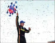  ?? KEVIN RIVOLI/THE SYRACUSE NEWSPAPERS VIA AP ?? In this Oct. 12, 2014, file photo, Stewart Friesen celebrates after winning the NAPA Super DIRT Week Syracuse 200 auto race at the New York State Fairground­s in Syracuse, N.Y. When the checkered flag waves for the final time, on Sunday, Oct. 11, 2015, it will be goodbye to one of only six mile-long dirt tracks remaining in the United States, according to local race historian Gary Spaid.