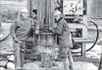  ??  ?? Drillmen Lee Berry and Tony Walker have been drilling for water at Shiskine. The drilling is only explorator­y and was being done on behalf of West of Scotland Water.