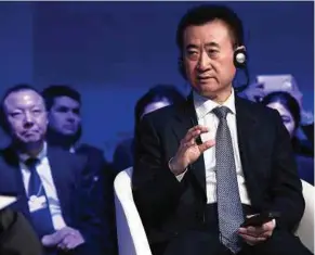  ?? BLOOMBERG PIC ?? Wang Jianlin’s Wanda Group revenue fell 5.7 per cent for the third year running to 214.3 billion yuan last year.