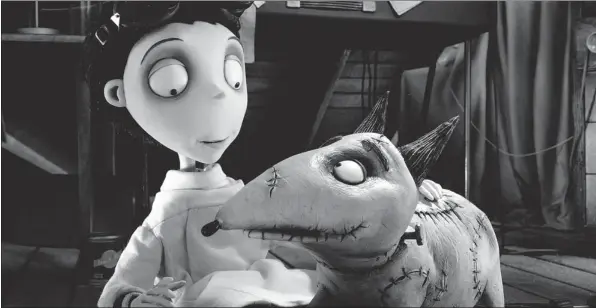  ??  ?? Victor Frankenste­in, voiced by Charlie Tahan, pats his dog Sparky, in a scene from Tim Burton’s Frankenwee­nie.
DISNEY/The Associated Press
