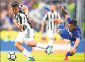  ??  ?? Juventus' Paulo Dybala (L) vies for the ball with Sampdoria's Lucas Torreira during the Italian Serie A football match at Allianz Stadium.