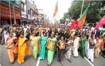  ?? — AFP photo ?? Indian Hindu devotees take part in a protest against a Supreme Court verdict revoking a ban on women’s entry to a Hindu temple, in Thiruvanan­thapuram in southern Kerala state.