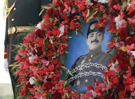  ??  ?? Flanked by an honour guard, a wreath to former Afghan king Amanullah Khan was laid on Kabul’s Minaret of Liberty by president Ashraf Ghani to mark the country’s 98th independen­ce day and liberation from British control