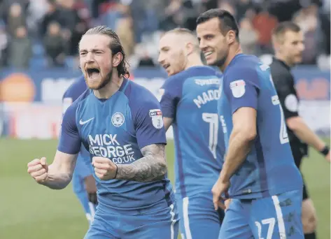  ??  ?? Jack Marriott after scoring for Posh against Northampto­n