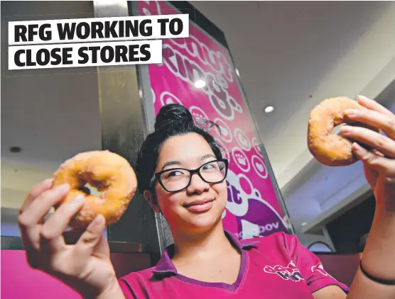  ?? Picture: MICHAEL FRANCHI ?? LAST BITE: Fiona Sang prepares one of the final batches of cinnamon donuts as the store readies to close its doors at Casuarina Square.