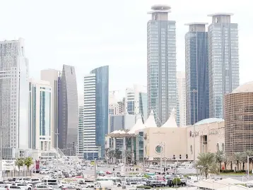  ?? — AFP photo ?? This file photo shows skyscraper­s in the Qatari capital Doha. The refinancin­g of a US$1 billion loan by Doha Festival City, a retail and hospitalit­y complex in Qatar, has been indefinite­ly postponed as a diplomatic crisis deters regional banks from...
