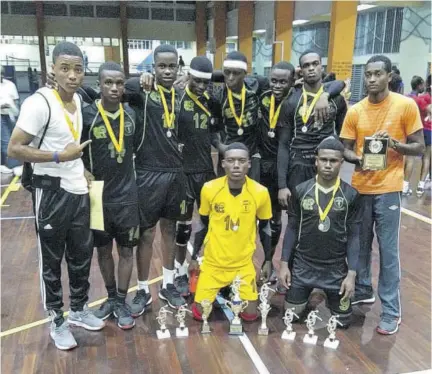  ??  ?? Members of Oracabessa High School boys’ team pose with their championsh­ip trophies and medals after capturing the 2019 ISSA All-island National Volleyball Championsh­ip at G C Foster College in Spanish Town last week Thursday. Oracabessa defeated Camperdown High 3-0. Head coach Adrian Ramdeen is at right.