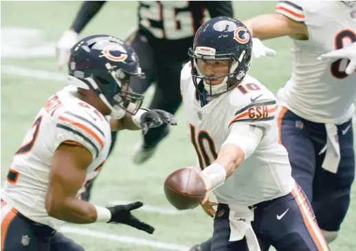  ?? BRYNN ANDERSON/AP ?? Mitch Trubisky, handing the ball off against the Falcons, continues to say the right things, even as his days with the Bears appear to be numbered.