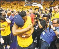  ?? Rick Bowmer / Associated Press ?? Utah Jazz guard Donovan Mitchell, center, hugs his father as he walks off the court following Game 6 of a first-round playoff series in Salt Lake City in 2018.