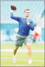  ?? Michael Reaves / Getty Images ?? Jake Fromm of the New York Giants throws the ball before a game against the Miami Dolphins on Sunday.