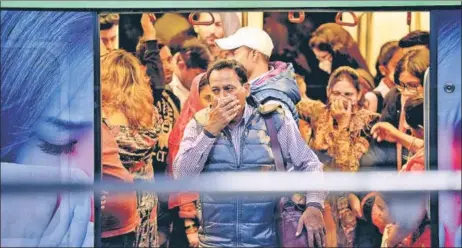  ?? RAJ K RAJ/HT PHOTO ?? ■ A commuter gets off a train at Rajiv Chowk Metro station on Friday.