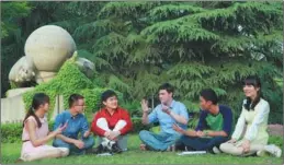  ?? PROVIDED TO CHINA DAILY ?? A group of students chat at the university.