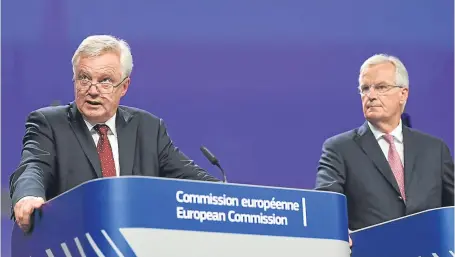  ?? Picture: Getty Images. ?? Brexit Secretary David Davis, left, and EU chief negotiator Michel Barnier explain their positions after four days of Brexit talks.