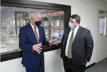  ?? The Sentinel-Record/Richard Rasmussen ?? ■ Gov. Asa Hutchinson, left, talks with FiberPro founder and CEO Josh Krauss at the company’s new facility Friday.