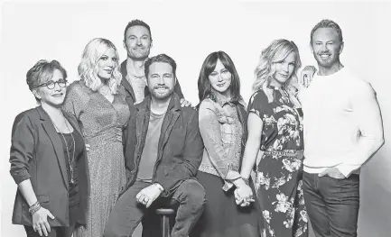  ??  ?? Gabrielle Carteris, left, Tori Spelling, Brian Austin Green, Jason Priestley, Shannen Doherty, Jennie Garth and Ian Ziering in “BH90210” BRIAN BOWEN SMITH/FOX