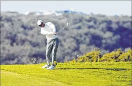  ?? Alex Gallardo The Associated Press ?? A police officer working crowd control at The Farmers Insurance Open in San Diego accepted a bet against Tiger Woods and gave his $20 winnings to a boy.