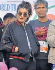  ?? IANS ?? Actors Raveena Tandon and Milind Soman during the Jaipur Marathon on Sunday.