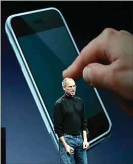 ?? PAUL SAKUMA / AP / FILE ?? Apple CEO Steve Jobs talks about the new iPhone during his keynote address at MacWorld Conference & Expo in San Francisco on Jan. 9, 2007.