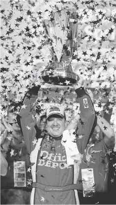  ?? FILE PHOTO BY MARK J. REBILAS, USA TODAY SPORTS ?? Stewart celebrates Nov. 20, 2011, at Homestead- Miami Speedway after winning his third Sprint Cup championsh­ip.