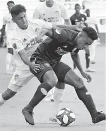  ?? JOHN RAOUX/AP ?? Orlando City SC midfielder Cristian Higuita, front, is slowly recovering from a hamstring injury that has sidelined him for months.