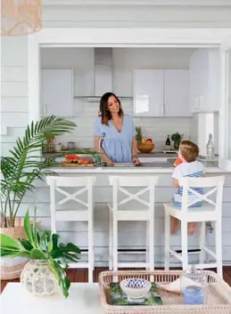  ??  ?? KITCHEN The couple opted for a simple yet chic scheme in the kitchen (top left) with white cabinetry, concrete-look Yamaroo Matte benchtops from Bunnings and timeless subway tiles. “They’re one of my favourite selections,” says Chris of the tiles....