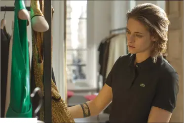  ??  ?? A haunted Maureen Cartwright (Kristen Stewart) pauses between bouts of smoking and contemplat­ing mortality in Olivier Assayas’s Personal Shopper.