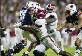  ?? ASSOCIATED PRESS FILE PHOTO ?? Alabama linebacker Will Anderson Jr. (31) stops Auburn wide receiver Elijah Canion (17) during the second half of an NCAA college football game, Nov. 27, in Auburn, Ala.