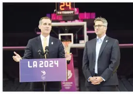  ??  ?? Los Angeles Mayor Eric Garcetti and LA 2024 Chairman Casey Wasserman hold a news conference on the Los Angeles Lakers' hard court floor inside Staples Center, one of the proposed venues, after a full day of meeting with the IOC Evaluation Commission...